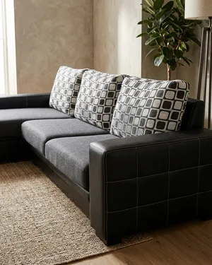 Sofá Chaise Longue Cherlon en Tela Gris y Piel Negra - miniatura 1