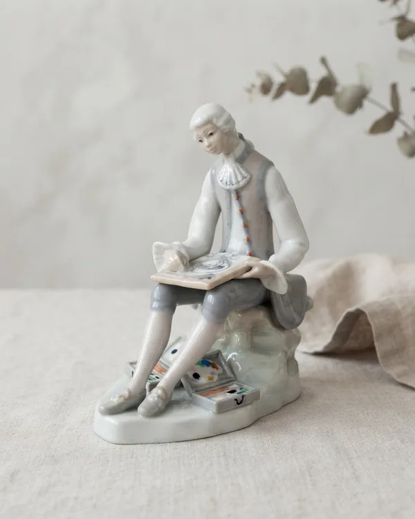 Figura de porcelana con hombre pintando